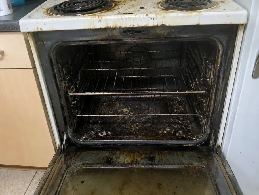 Oven before cleaning — heavy carbon buildup